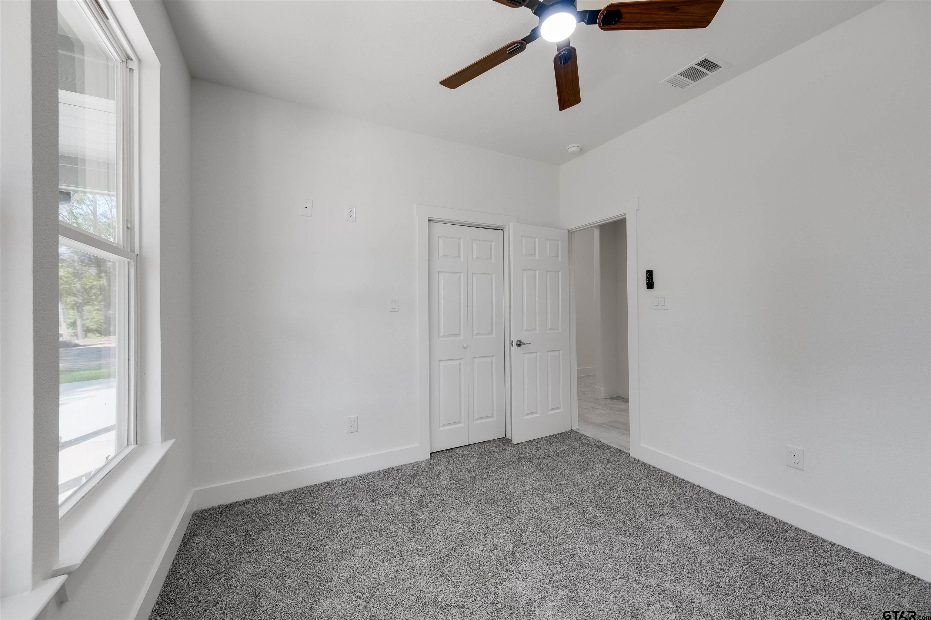 201 Victory Street Palestine, TX 75803 - Photo 24 of 37 a view of an empty room with a window