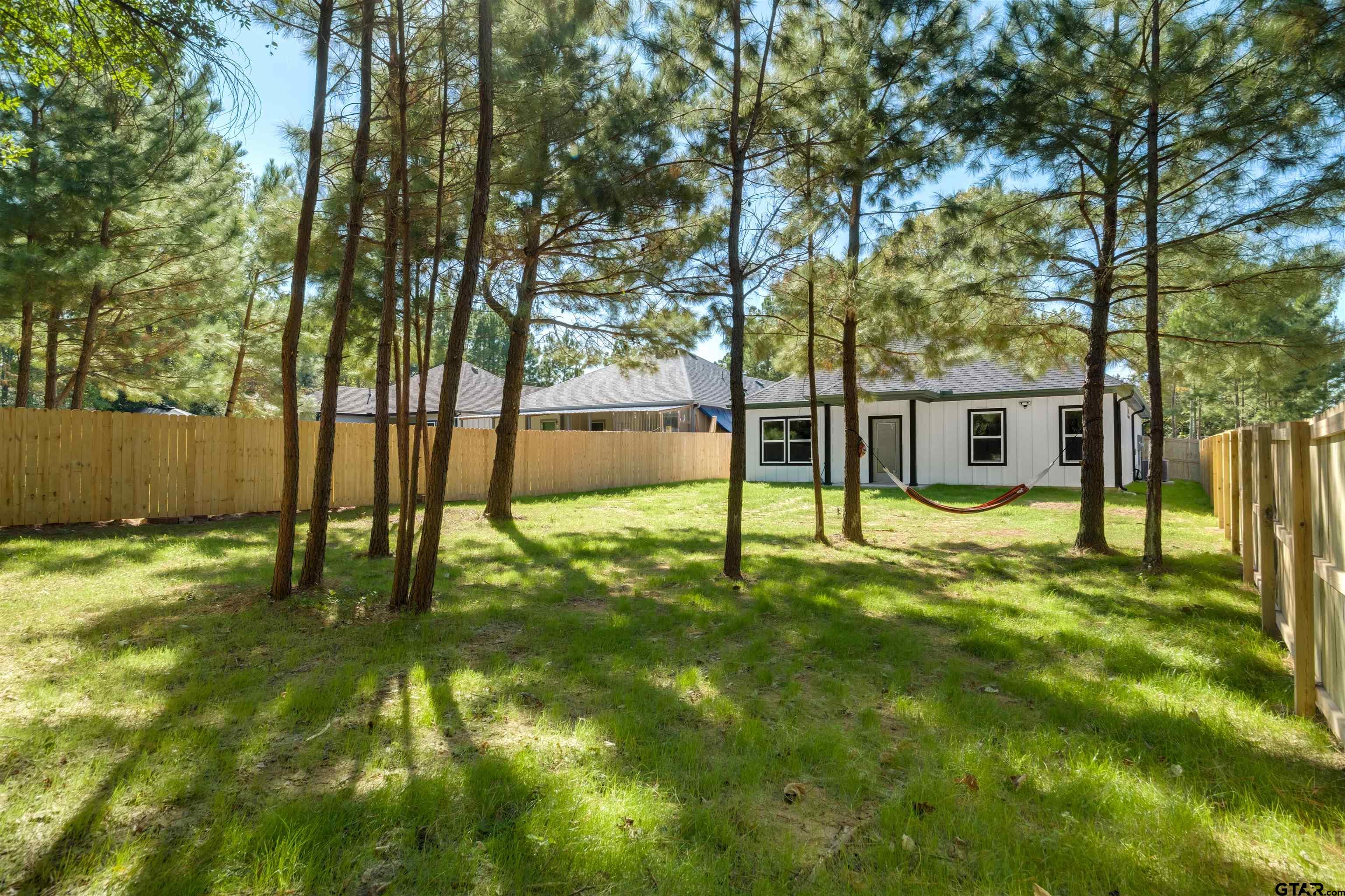 201 Victory Street Palestine, TX 75803 - Photo 37 of 37 a swimming pool with some trees in the background