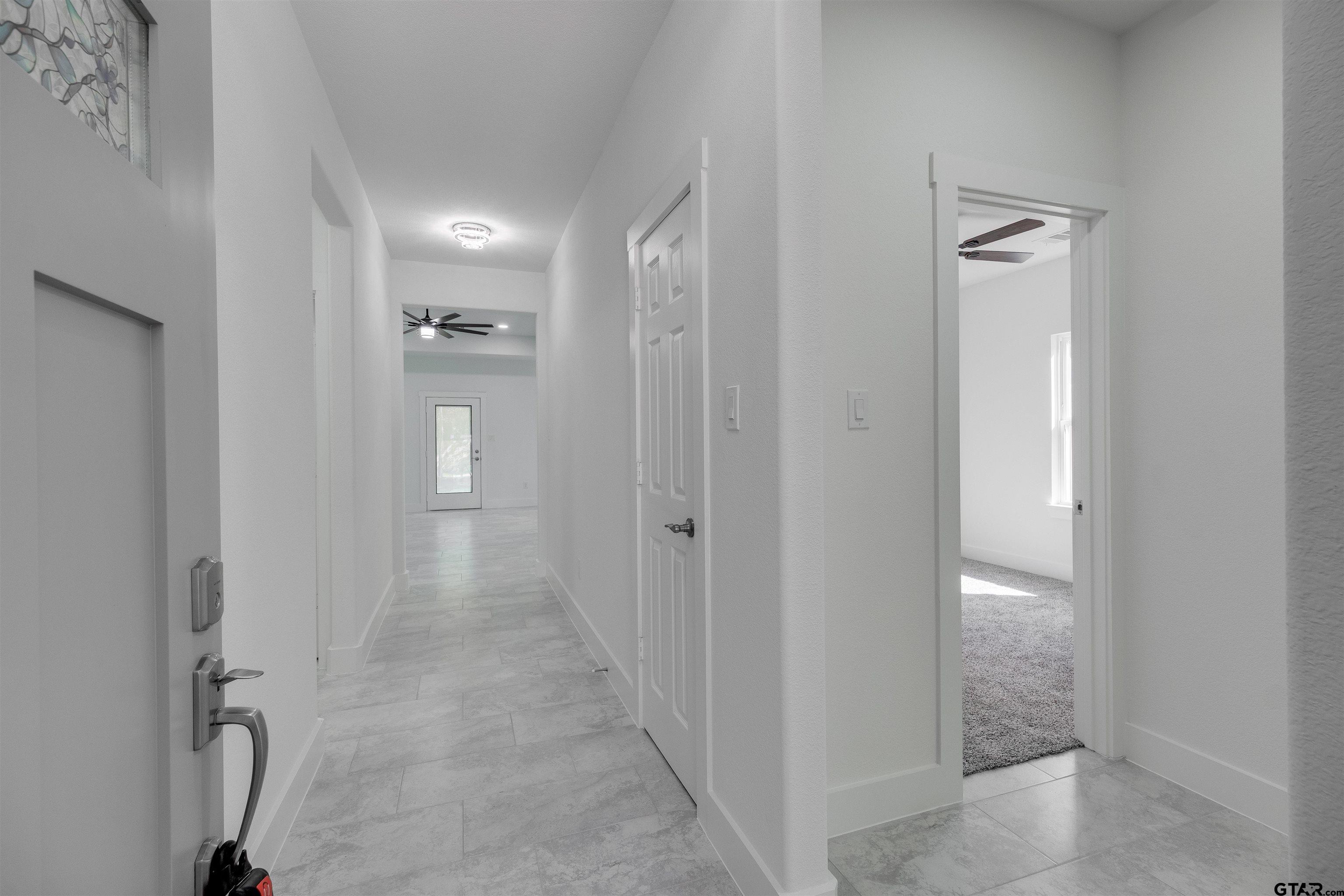 201 Victory Street Palestine, TX 75803 - Photo 4 of 37 a view of a hallway with closet and wooden floor