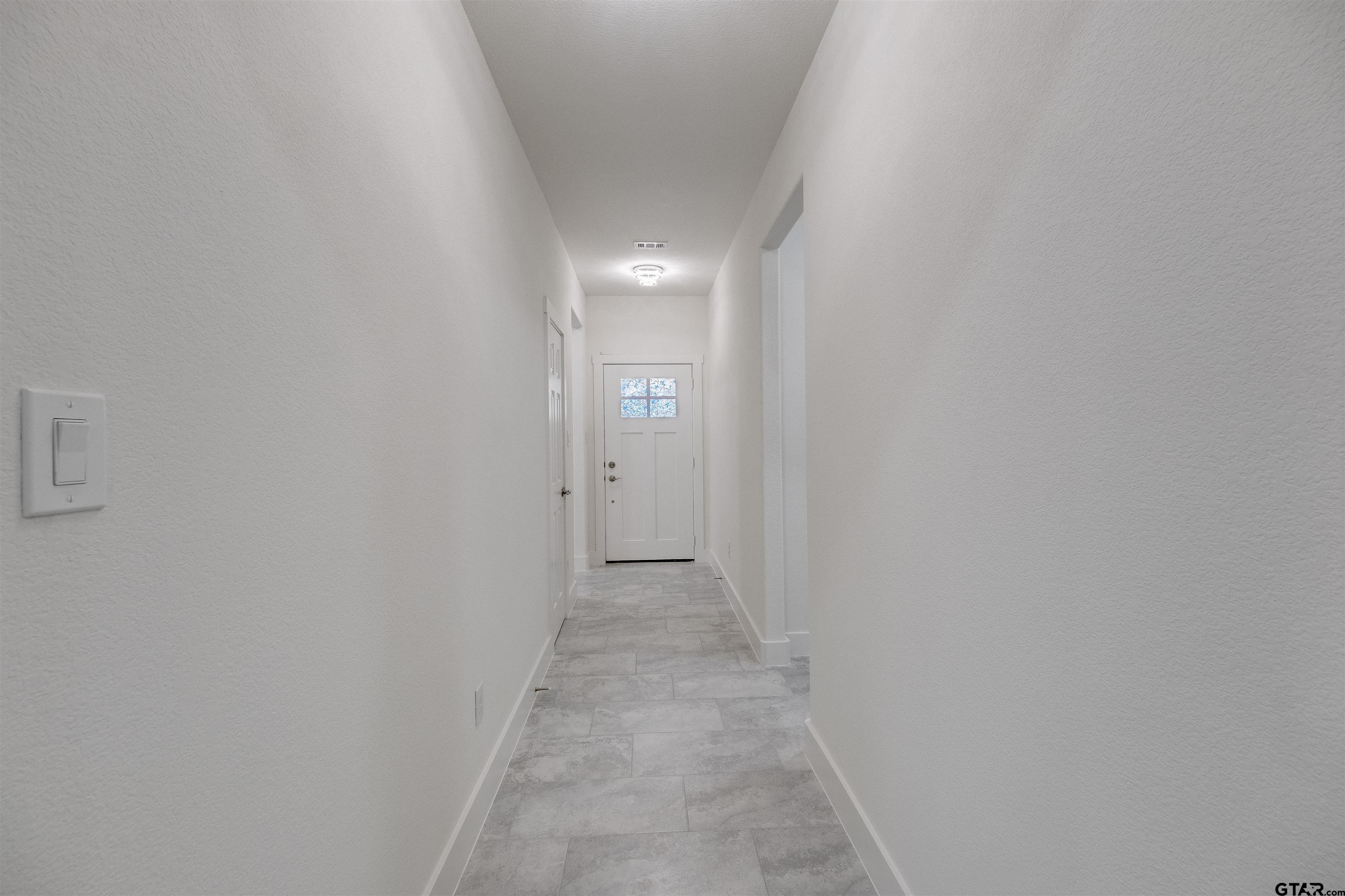 201 Victory Street Palestine, TX 75803 - Photo 6 of 37 a view of a hallway with wooden floor