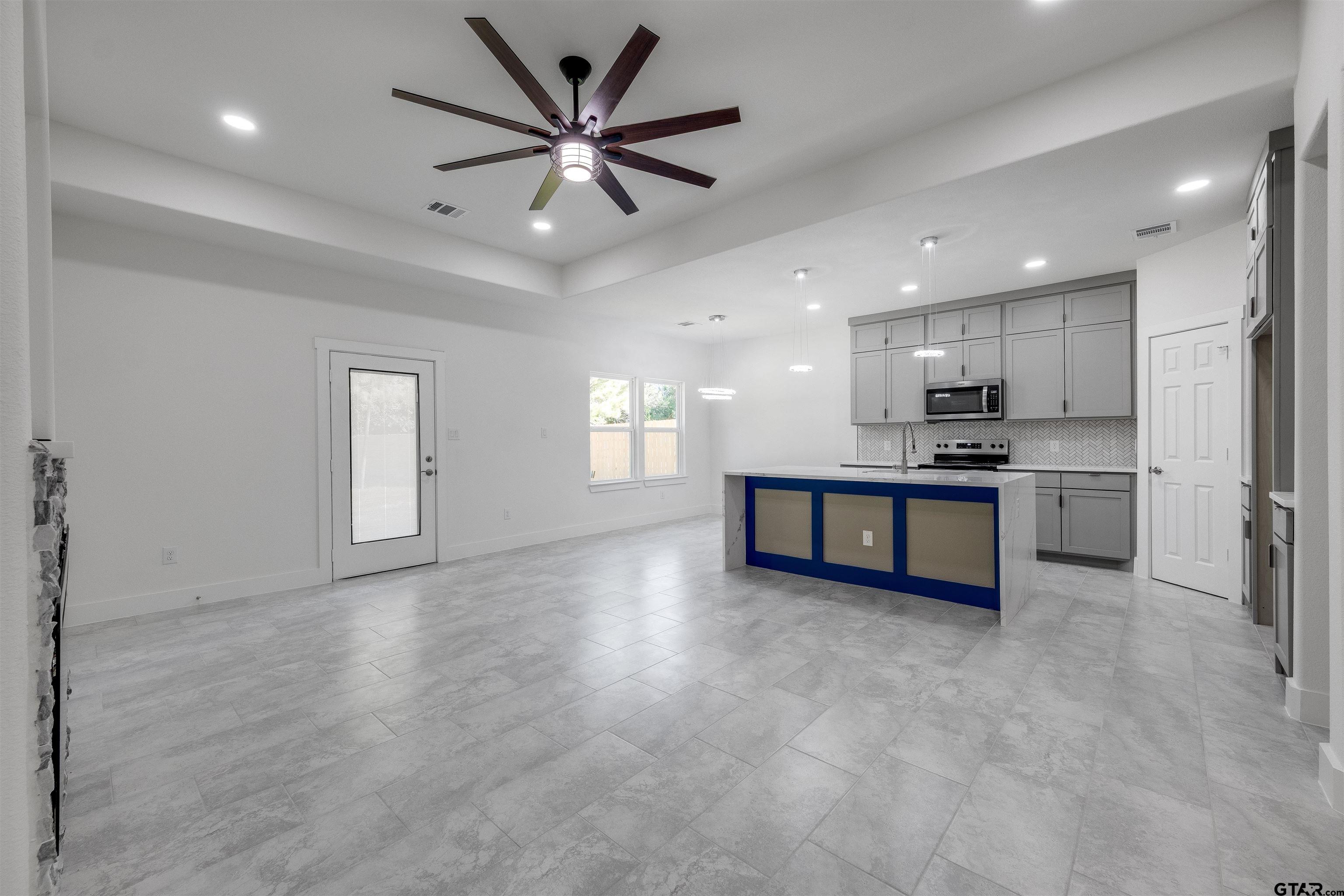 201 Victory Street Palestine, TX 75803 - Photo 8 of 37 a view of kitchen with refrigerator and window