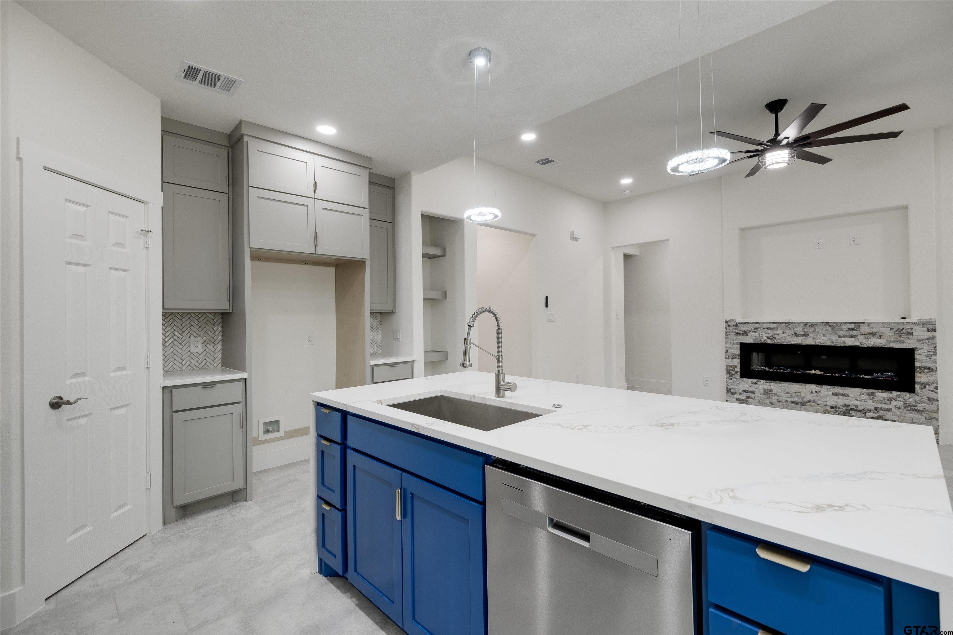 201 Victory Street Palestine, TX 75803 - Photo 10 of 37 a kitchen with stainless steel appliances a sink and a refrigerator