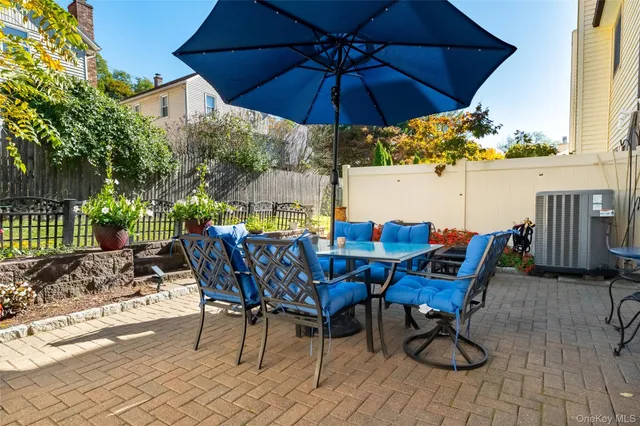 a view of a chairs and table in patio