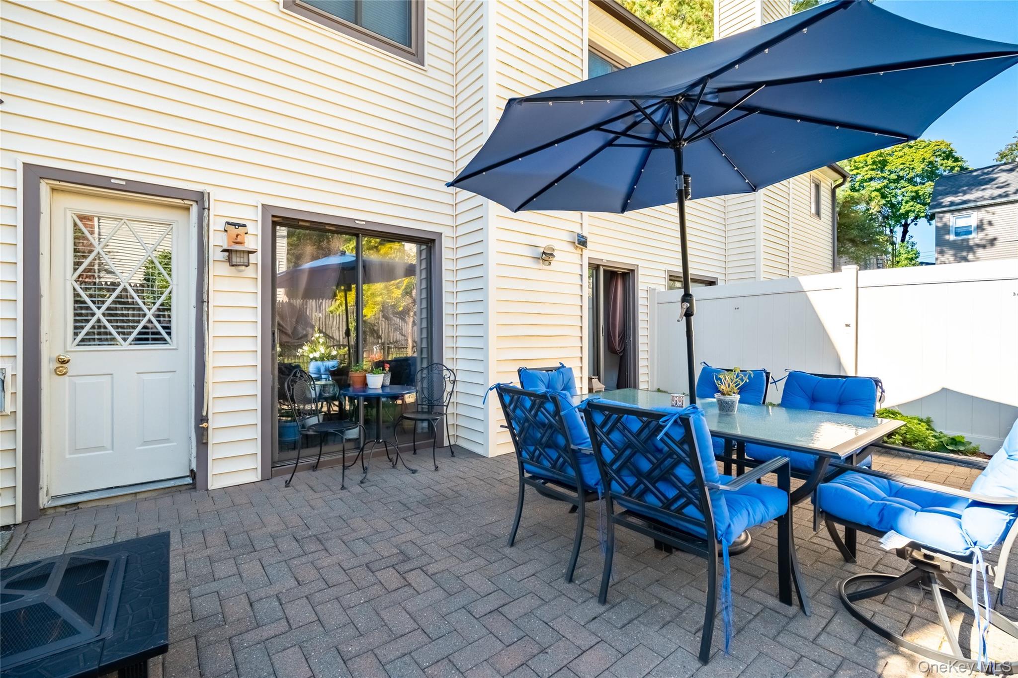 66 Leroy Avenue Valhalla, NY 10595 - Photo 31 of 31 a view of a dinning table and chairs in the patio