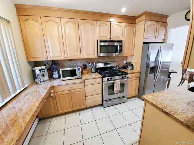 a kitchen with a sink a stove and cabinets