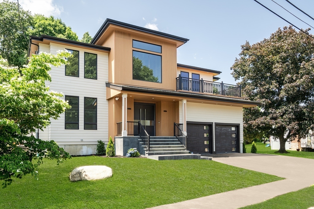 front view of a house with a yard