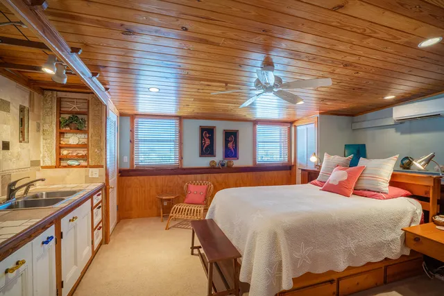 a bedroom with furniture and windows