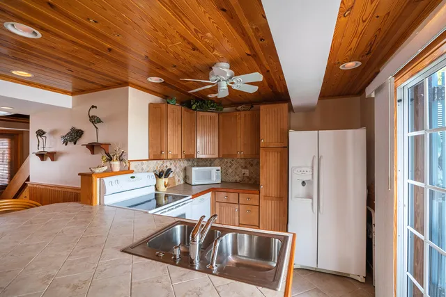 a very nice looking kitchen with a large window