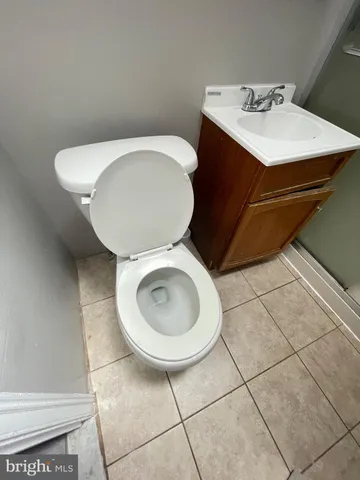 a bathroom with a toilet and a sink