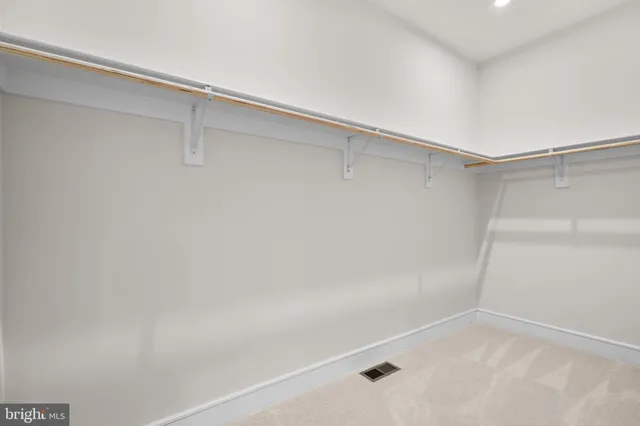 a bathroom with a shower sink and mirror