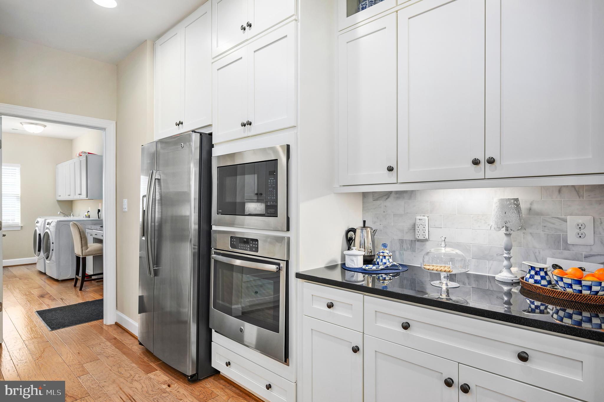 42867 Beaver Crossing Square Ashburn, VA 20148 - Photo 16 of 33 White cabinets and stainless steel appliances