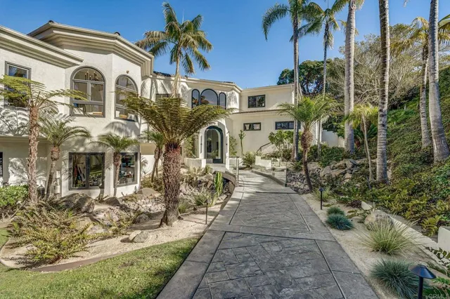 a living room with furniture fireplace and wooden floor