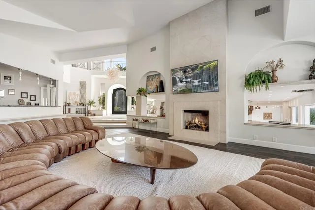 a view of living room with furniture and a chandelier