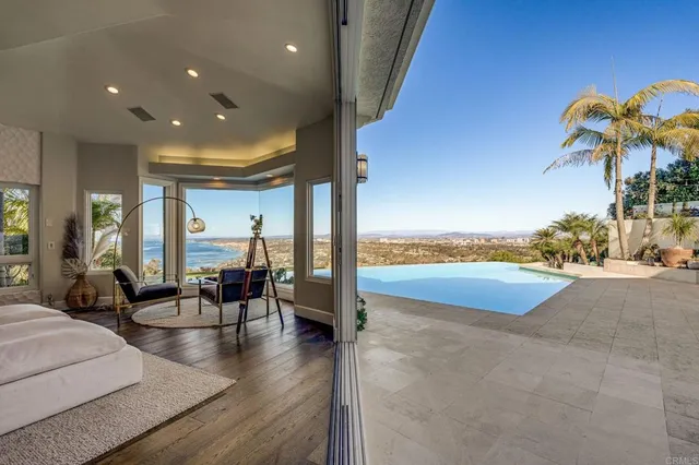 a view of a patio with swimming pool table and chairs