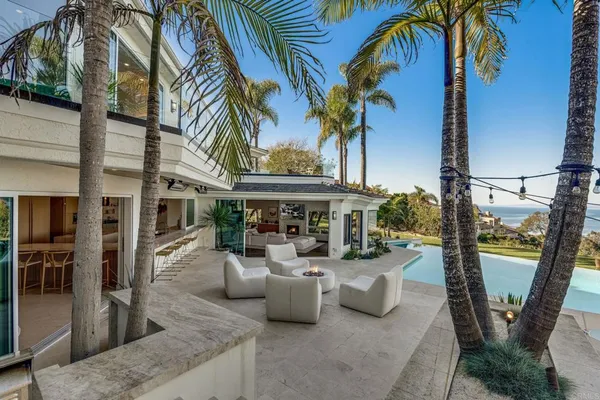 a house with swimming pool in front of it
