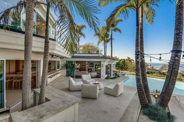 a house with swimming pool in front of it