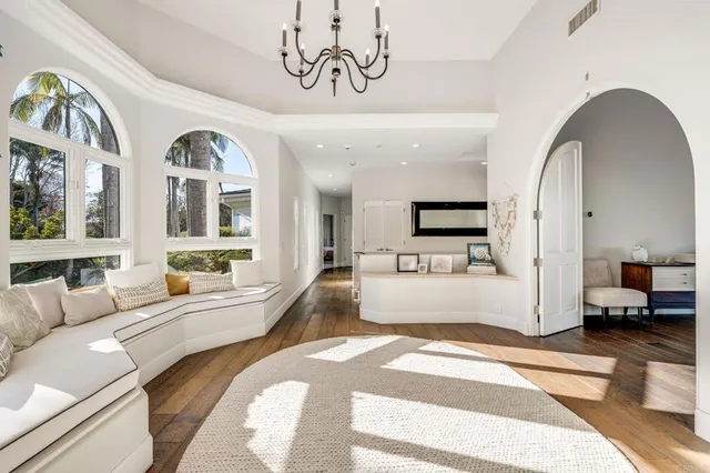 a large white bathroom with a large tub shower and sink