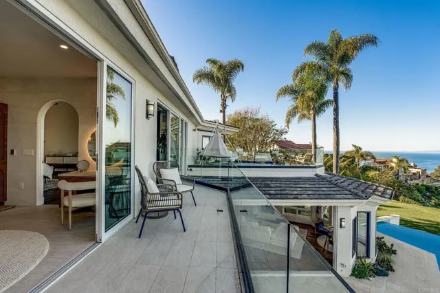 a bedroom with furniture and a large mirror