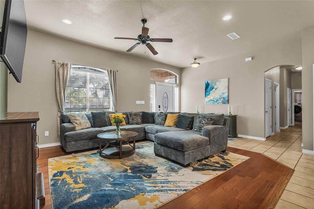 226 King George Road Ponder, TX 76259 - Photo 24 of 39 Living room featuring arched walkways, a ceiling fan, light wood-style flooring, recessed lighting, and washer / clothes dryer