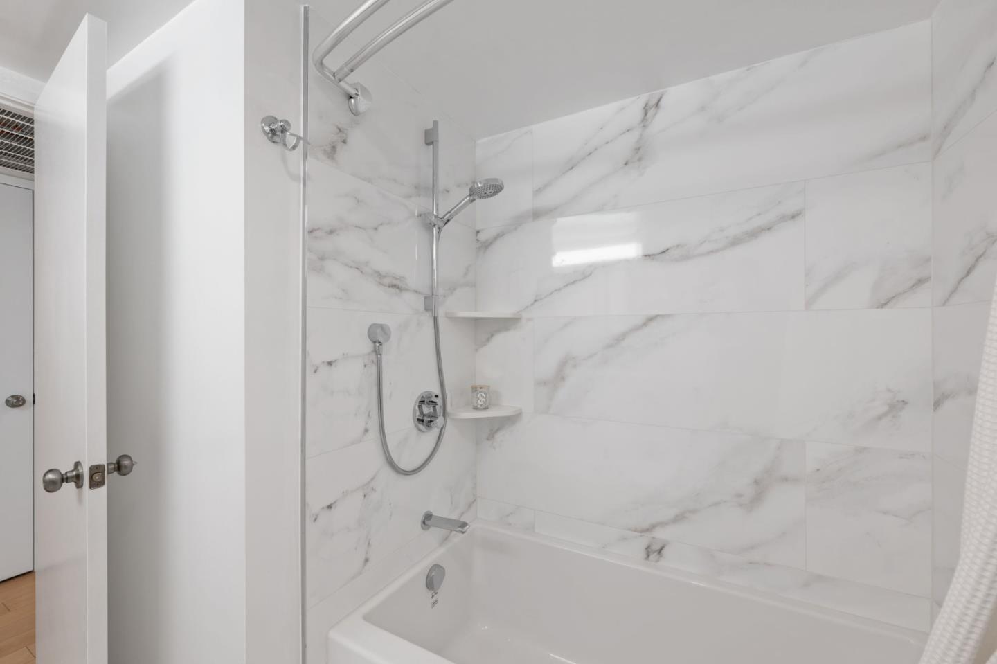 473 Costa Mesa Terrace, Unit C Sunnyvale, CA 94085 - Photo 17 of 40 a bathroom with a bath tub and a shower