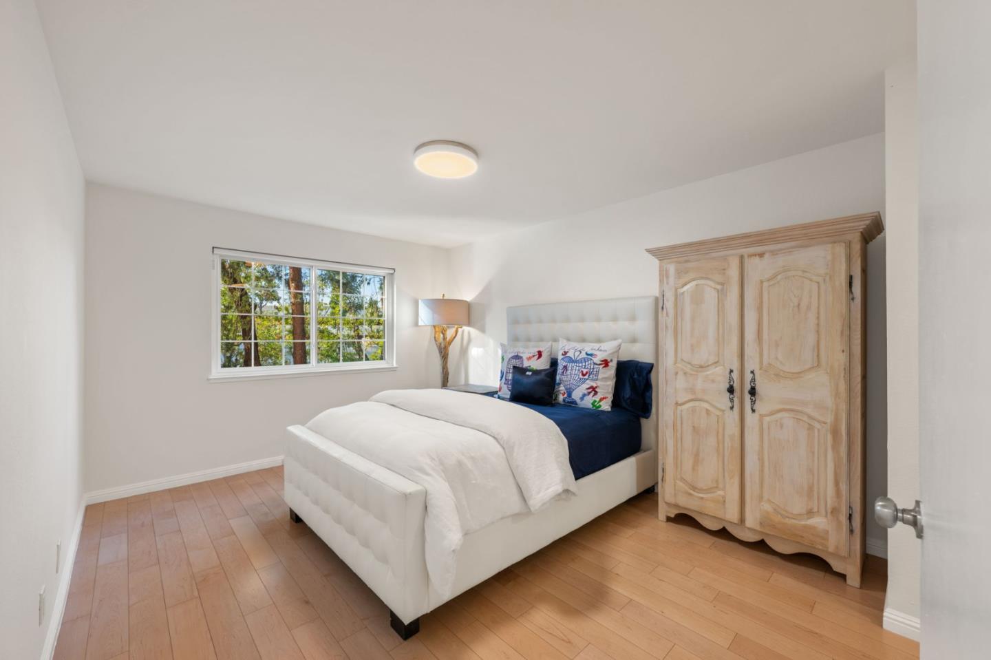 473 Costa Mesa Terrace, Unit C Sunnyvale, CA 94085 - Photo 19 of 40 a bed room with a bed and a window