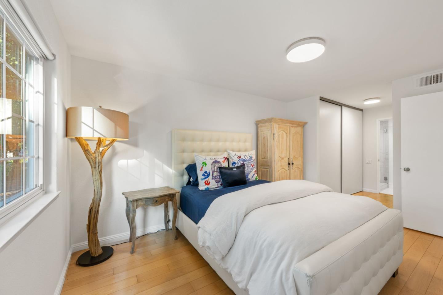 473 Costa Mesa Terrace, Unit C Sunnyvale, CA 94085 - Photo 20 of 40 a bedroom with a bed and a window