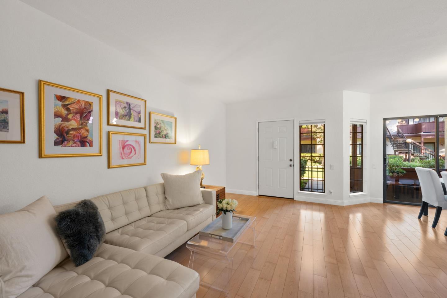 473 Costa Mesa Terrace, Unit C Sunnyvale, CA 94085 - Photo 2 of 40 a living room with furniture and wooden floor