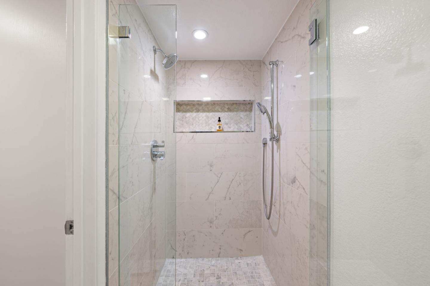 473 Costa Mesa Terrace, Unit C Sunnyvale, CA 94085 - Photo 22 of 40 a bathroom with a shower and a glass door
