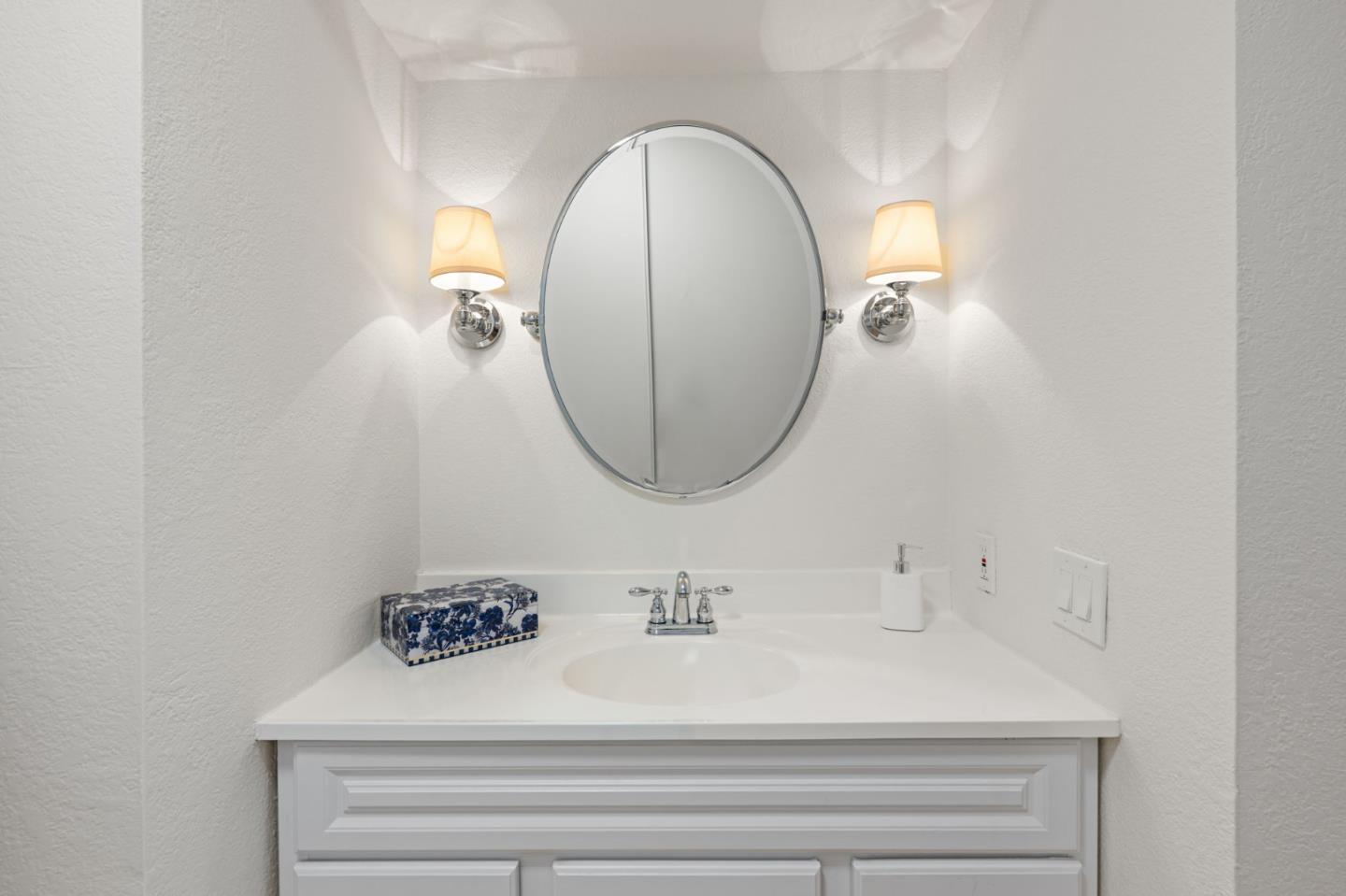 473 Costa Mesa Terrace, Unit C Sunnyvale, CA 94085 - Photo 23 of 40 a bathroom with a sink and a mirror