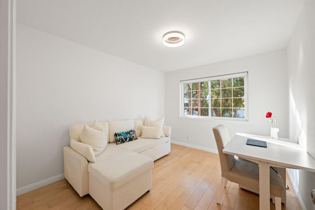 a living room with furniture and window