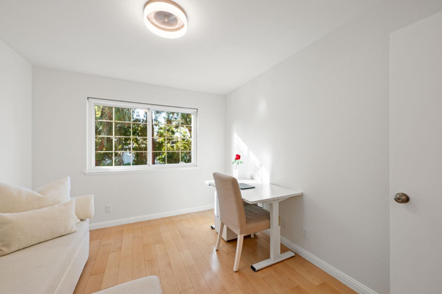 473 Costa Mesa Terrace, Unit C Sunnyvale, CA 94085 - Photo 25 of 40 a view of a workspace with furniture and a window