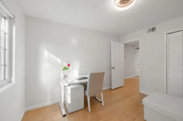 a workspace with furniture and a window