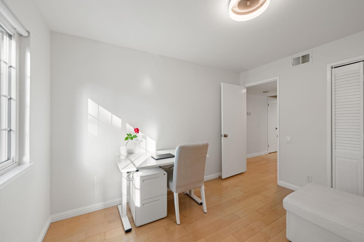 473 Costa Mesa Terrace, Unit C Sunnyvale, CA 94085 - Photo 26 of 40 a workspace with furniture and a window