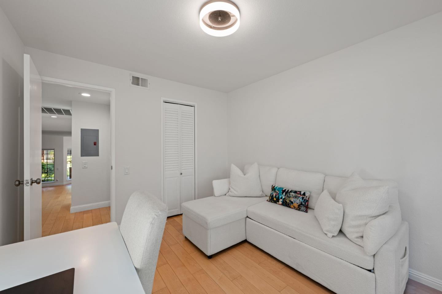 473 Costa Mesa Terrace, Unit C Sunnyvale, CA 94085 - Photo 27 of 40 a living room with furniture and a couch