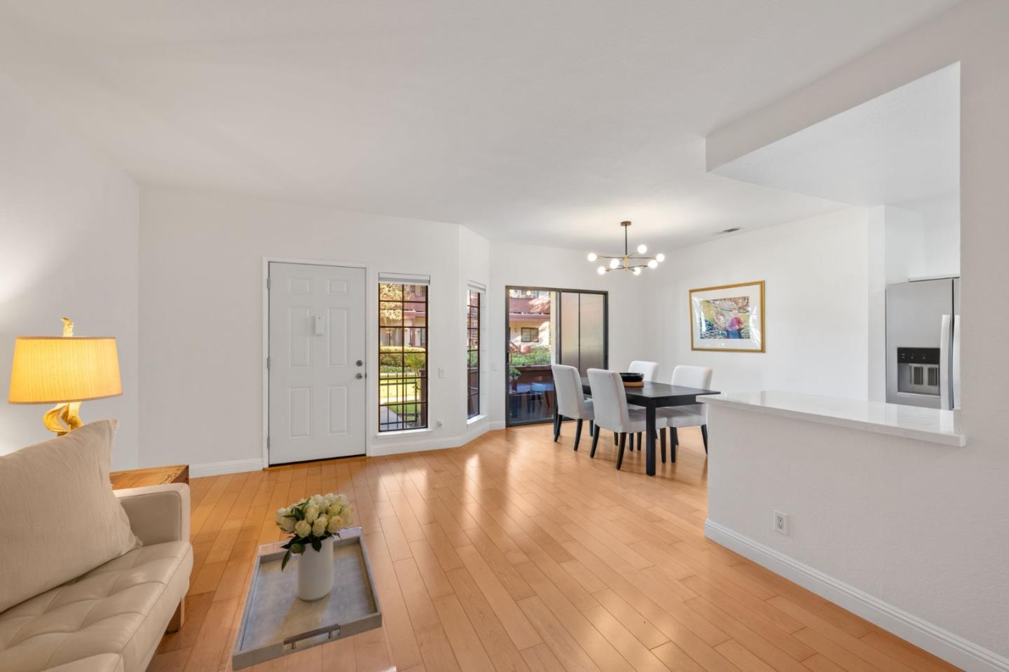 473 Costa Mesa Terrace, Unit C Sunnyvale, CA 94085 - Photo 3 of 40 a living room with furniture and a wooden floor