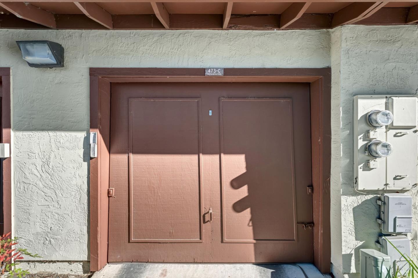 473 Costa Mesa Terrace, Unit C Sunnyvale, CA 94085 - Photo 32 of 40 a bathroom with a granite countertop sink and a mirror
