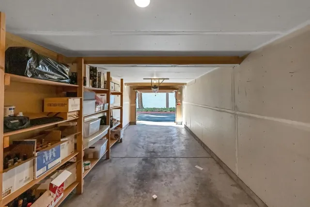 a room with lots of furniture and a window