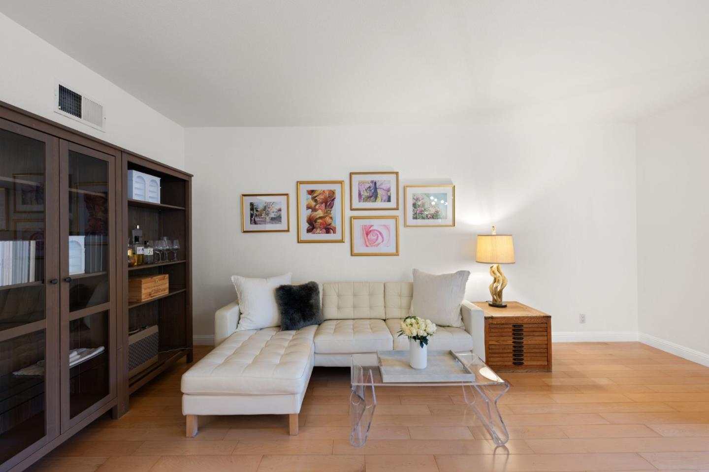 473 Costa Mesa Terrace, Unit C Sunnyvale, CA 94085 - Photo 5 of 40 a living room with furniture and a lamp