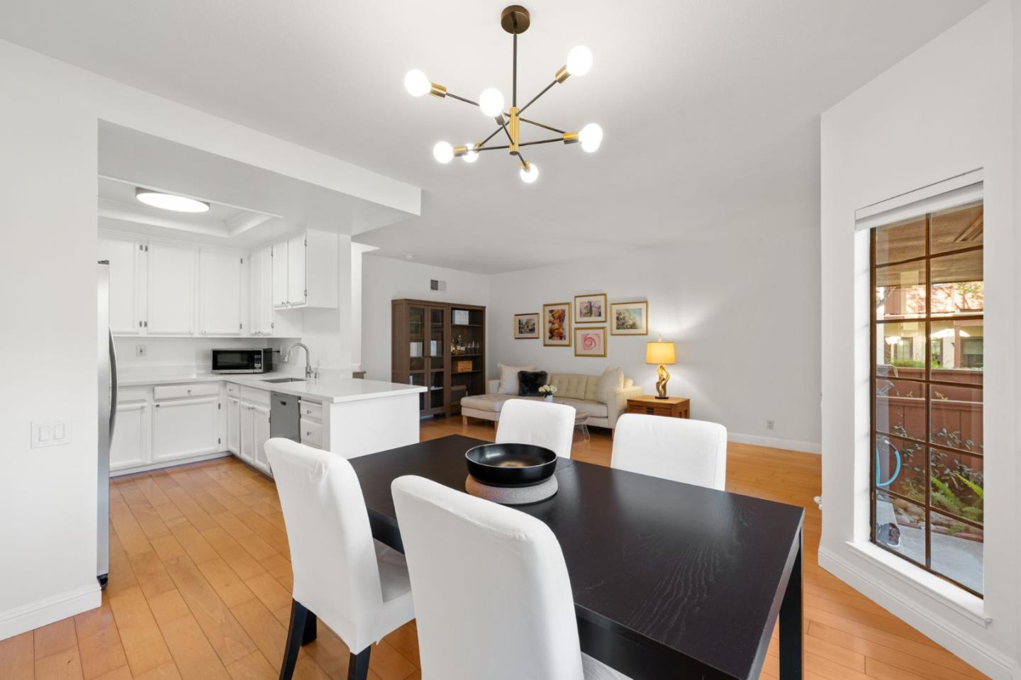 473 Costa Mesa Terrace, Unit C Sunnyvale, CA 94085 - Photo 9 of 40 a view of a dining room with furniture and wooden floor