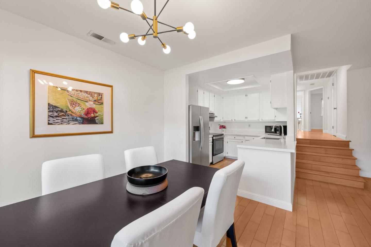 473 Costa Mesa Terrace, Unit C Sunnyvale, CA 94085 - Photo 10 of 40 a living room with furniture and kitchen view