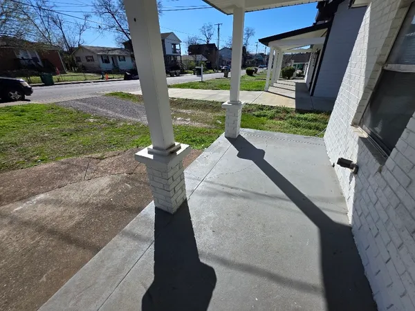 a view of a porch with yard