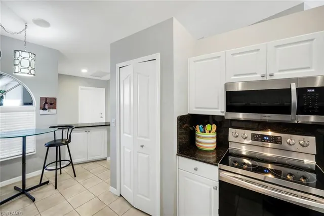 a kitchen with a stove and a microwave