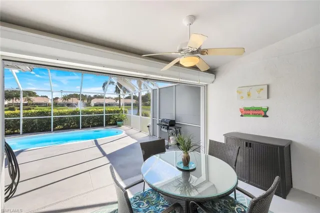 a living room with furniture a dining table and a dining table