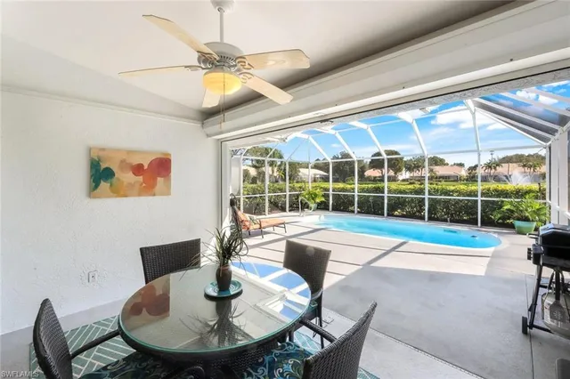 a view of a dining room with furniture wooden floor and chandelier