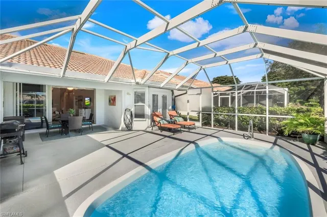 a view of a lake with houses in the background