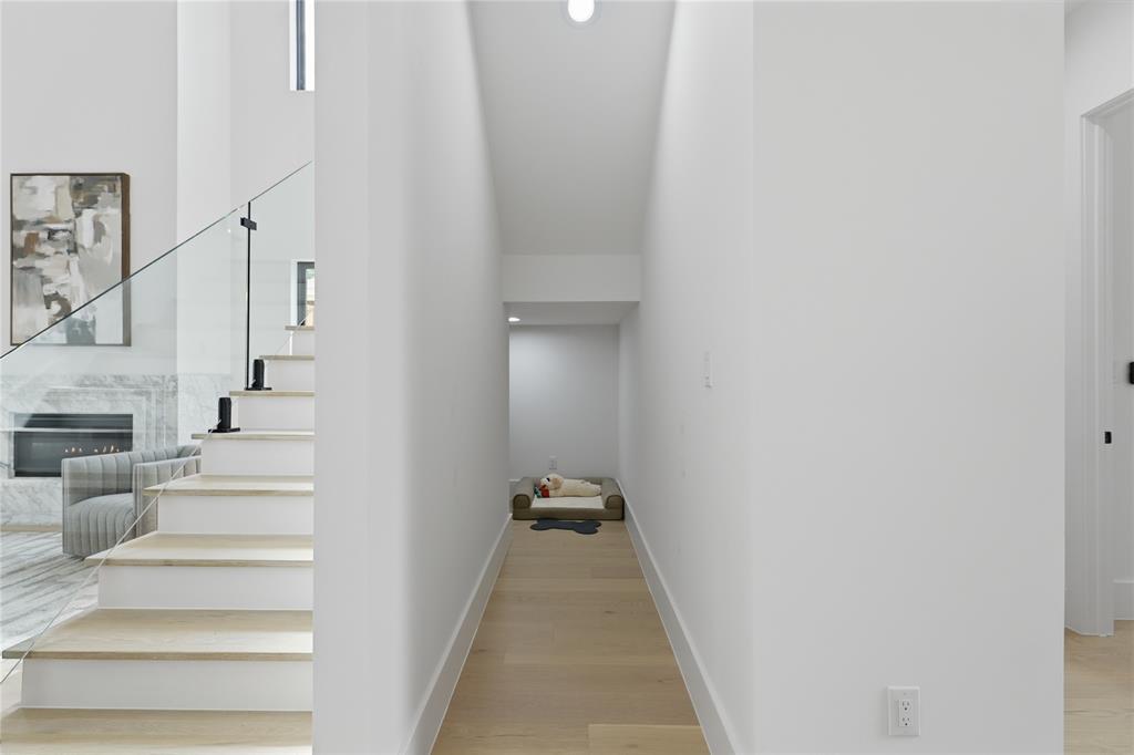 6038 Prospect Avenue Dallas, TX 75206 - Photo 6 of 40 Modern staircase with clear glass railing and black hardware