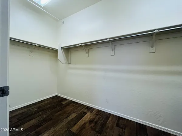 a view of a room with wooden floor and staircase
