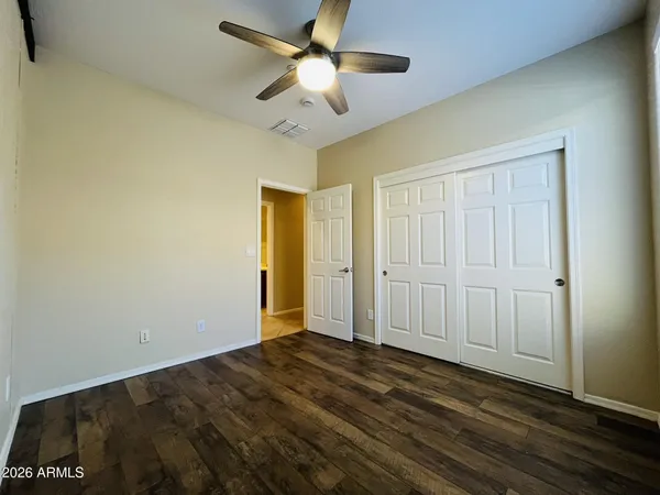a view of a livingroom with a chandelier fan