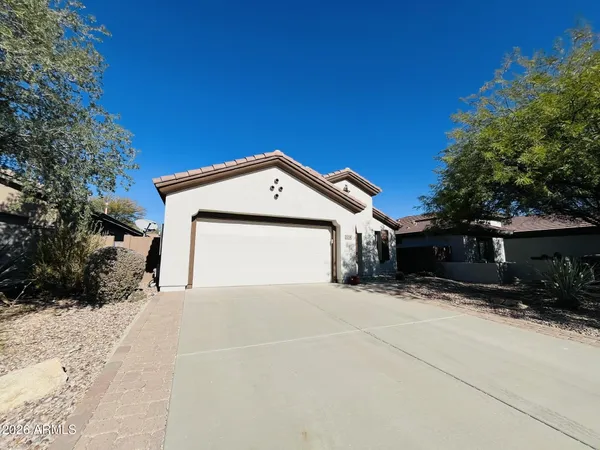 a view of a house with a yard and garage