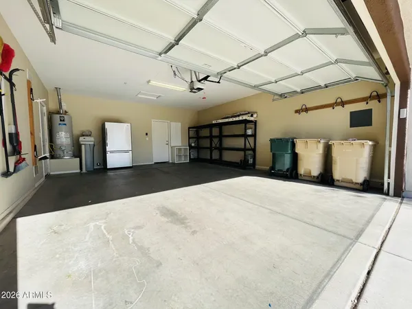 a view of a livingroom with furniture and a ceiling fan